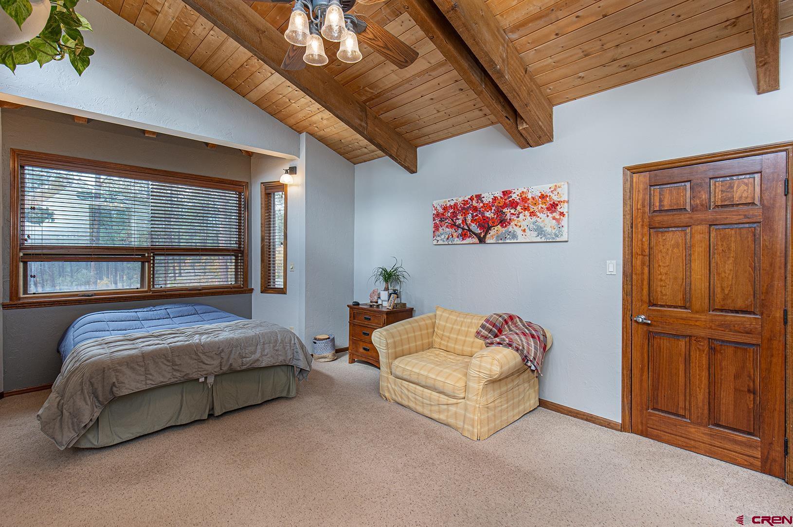 375 Nusbaum Road Durango, CO 81301 - Photo 16 of 33 a bedroom with a bed and a window