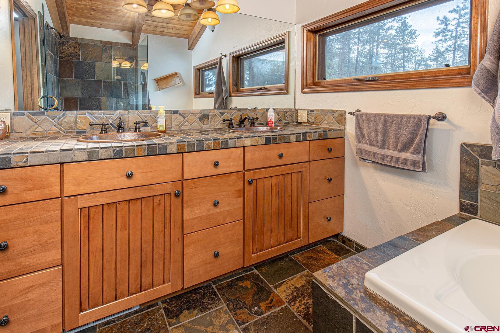 375 Nusbaum Road Durango, CO 81301 - Photo 18 of 33 a bathroom with a sink and a mirror