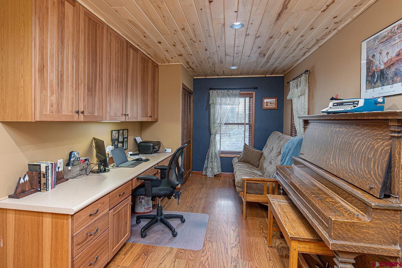 375 Nusbaum Road Durango, CO 81301 - Photo 24 of 33 a view of a workspace with furniture and wooden floor