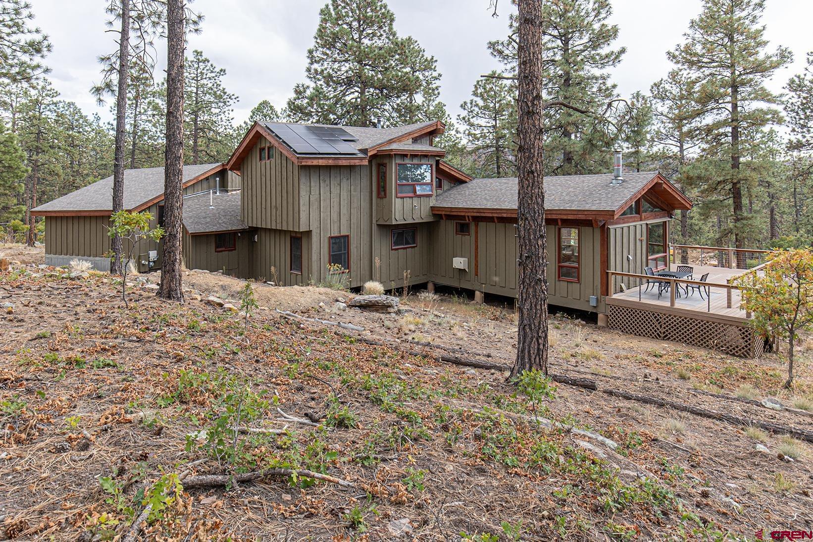 375 Nusbaum Road Durango, CO 81301 - Photo 6 of 33 a front view of a house with a yard covered in snow