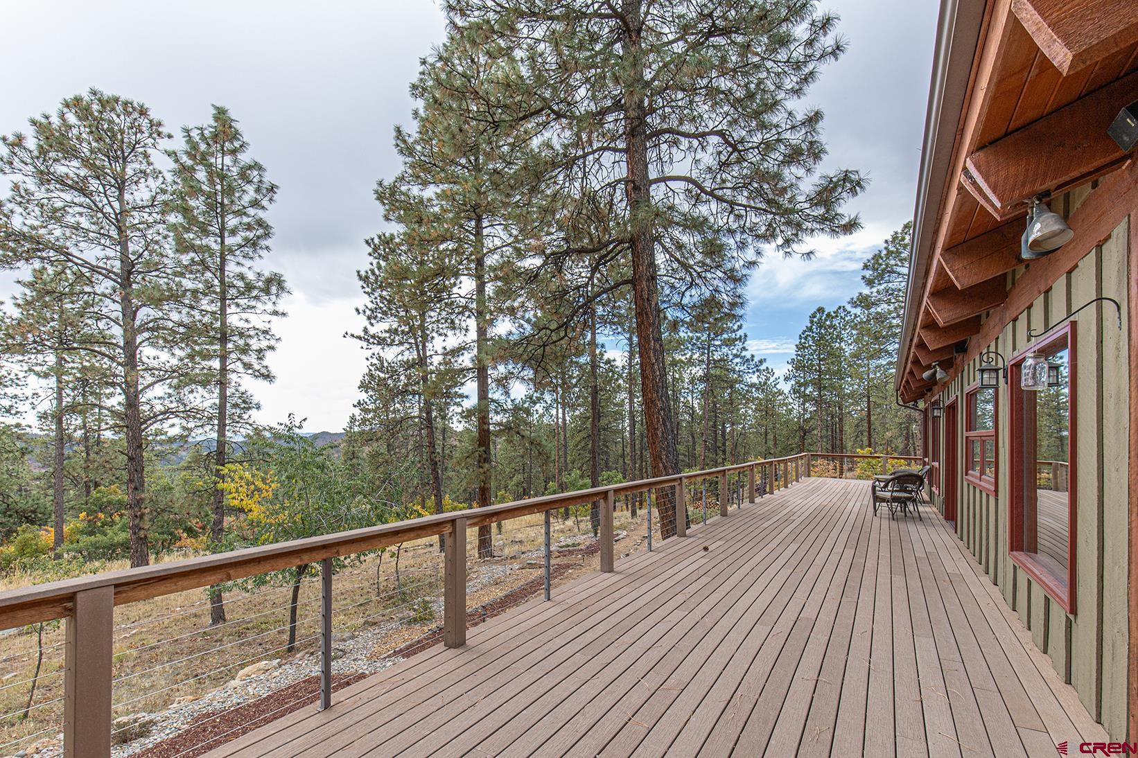 375 Nusbaum Road Durango, CO 81301 - Photo 7 of 33 a view of a balcony with wooden floor and fence