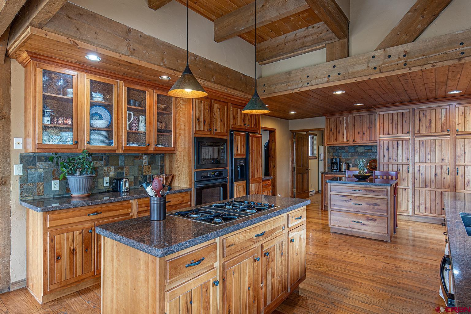 375 Nusbaum Road Durango, CO 81301 - Photo 10 of 33 a kitchen with stainless steel appliances granite countertop a stove and a refrigerator