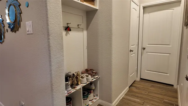 a view of a storage & utility room with dryer and washer