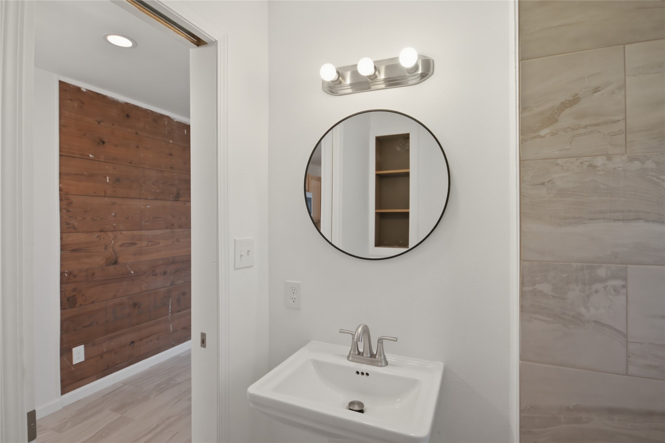 3518 Orange Street Houston, TX 77020 - Photo 18 of 27 a bathroom with a sink and a mirror
