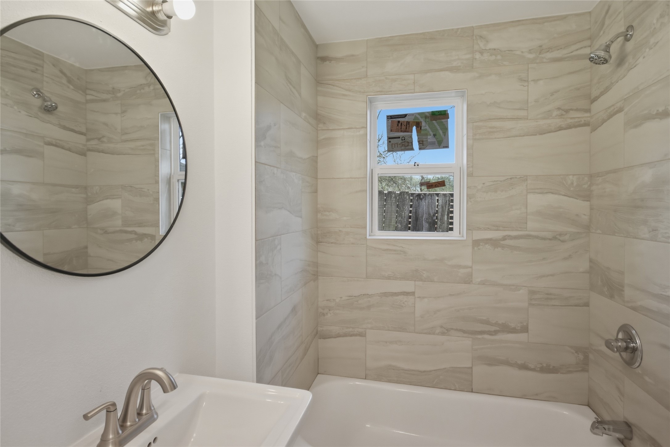 3518 Orange Street Houston, TX 77020 - Photo 19 of 27 a bathroom with a sink and a mirror