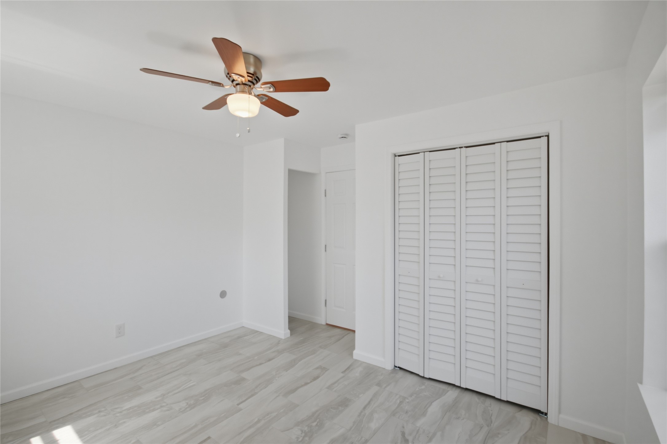 3518 Orange Street Houston, TX 77020 - Photo 25 of 27 a view of empty room with wooden floor and ceiling fan