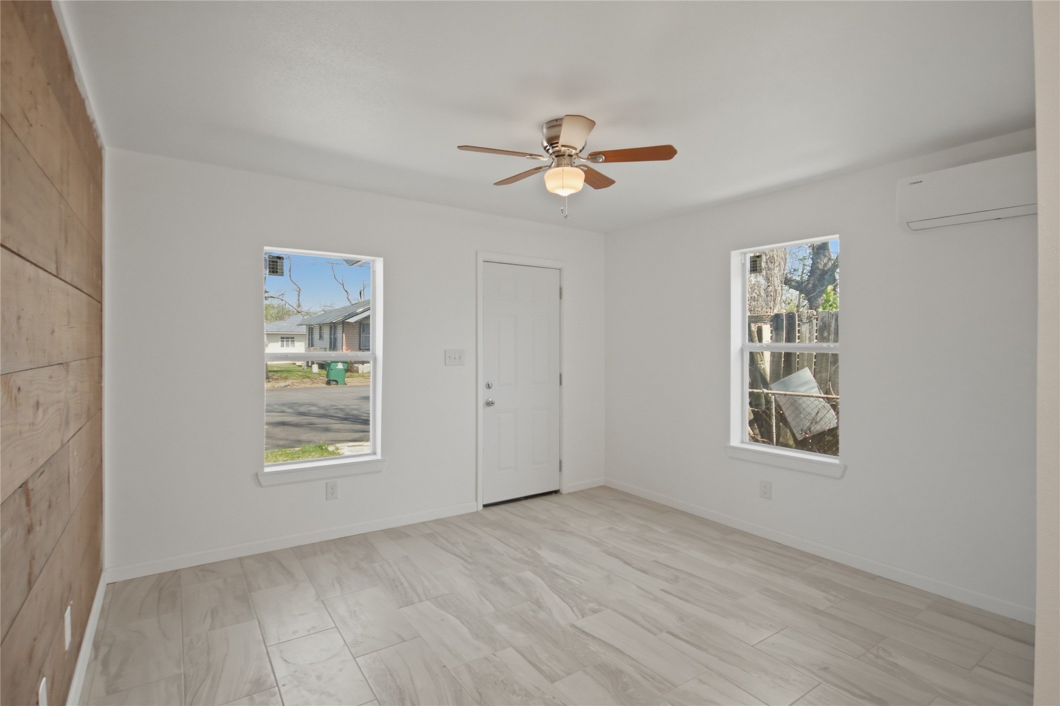 3518 Orange Street Houston, TX 77020 - Photo 5 of 27 wooden floor in an empty room with a window