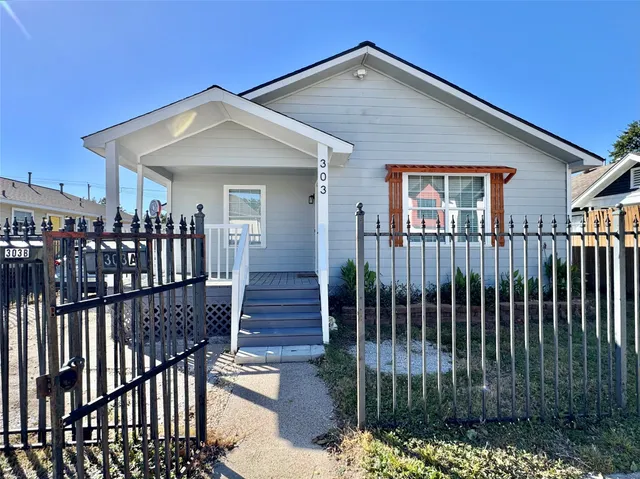 a view of a house with wooden deck