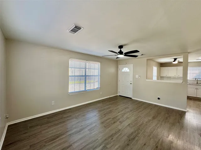 a large kitchen with a large counter top appliances and cabinets