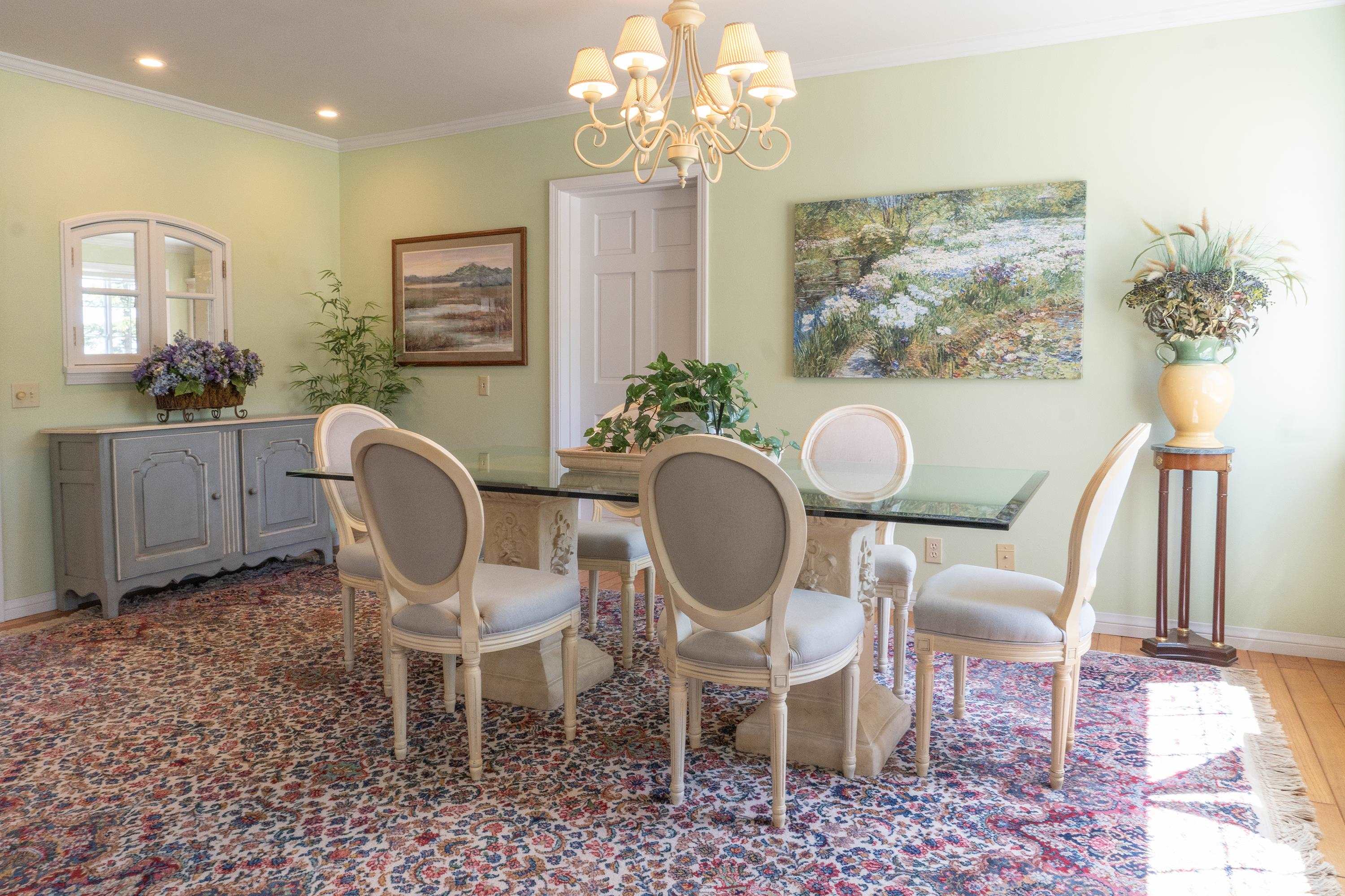 416 Wilson Creek Road Lee Vining, CA 93541 - Photo 13 of 64 a dining room with furniture a rug a potted plant and a chandelier