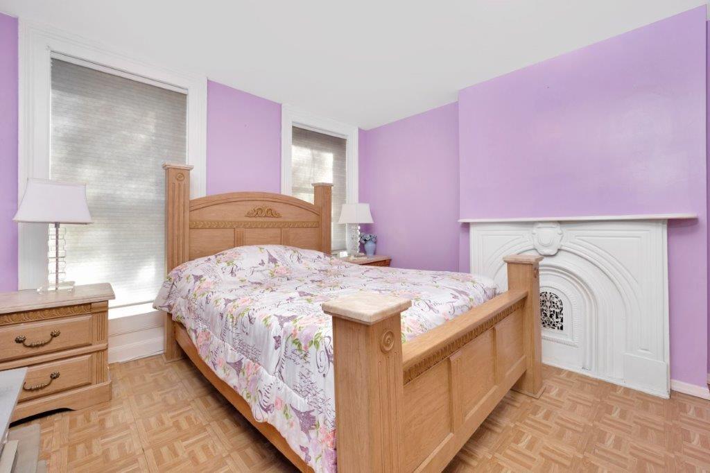 964 Gates Avenue Brooklyn, NY 11221 - Photo 18 of 25 a bedroom with a bed and a dresser