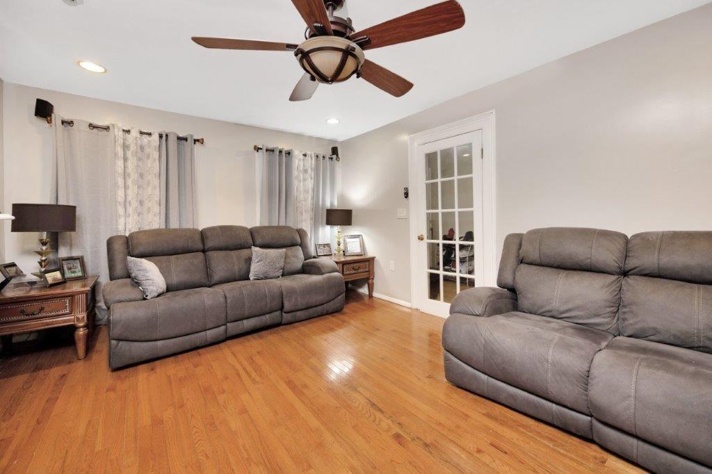 964 Gates Avenue Brooklyn, NY 11221 - Photo 5 of 25 a living room with furniture and a large window