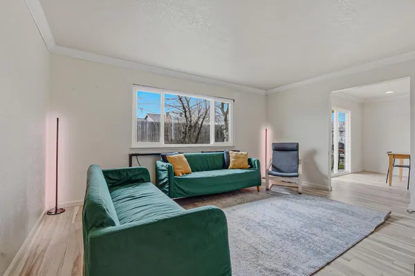 a living room with furniture and a window