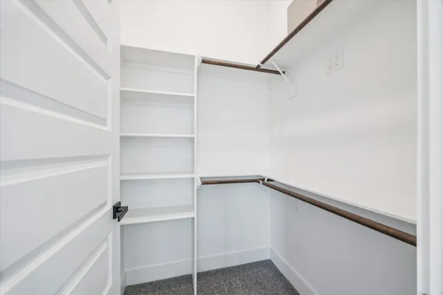 a view of an empty walk in closet