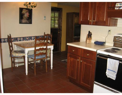 535 Westover Road Mt. Lebanon, PA 15228 - Photo 6 of 13 Kitchen. Kitchen table area leading into family room and door to 3-season room