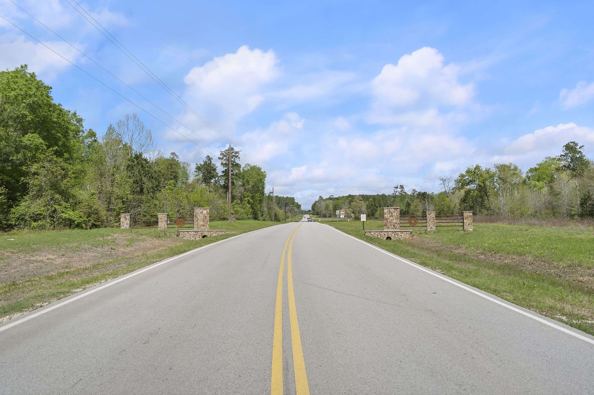 14-15a PROSPERITY Court Huntsville, TX 77340 - Photo 17 of 27 a view of a street with a big yard