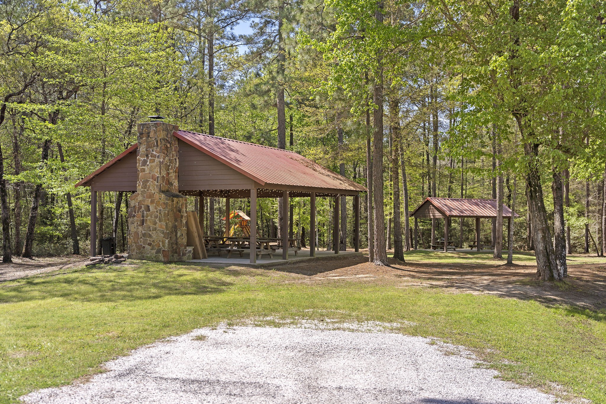 14-15a PROSPERITY Court Huntsville, TX 77340 - Photo 20 of 27 a backyard of a house with yard and outdoor seating