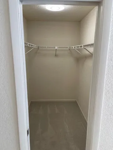 a view of a room with racks on the wall