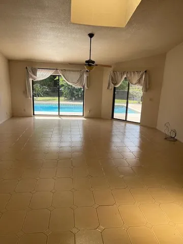 a view of an empty room and window