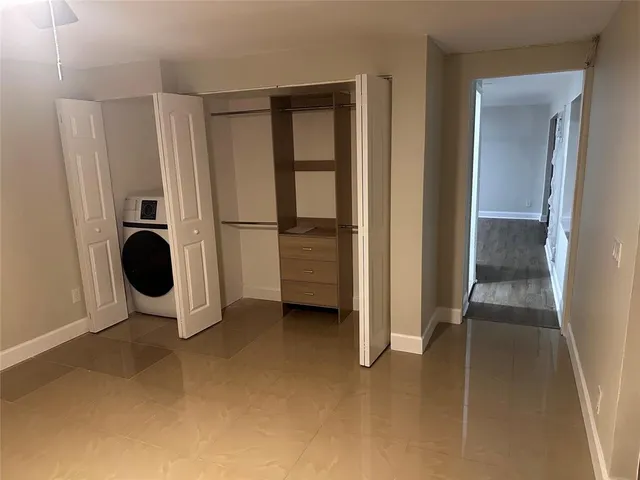 a view of a storage & utility room with washer and dryer
