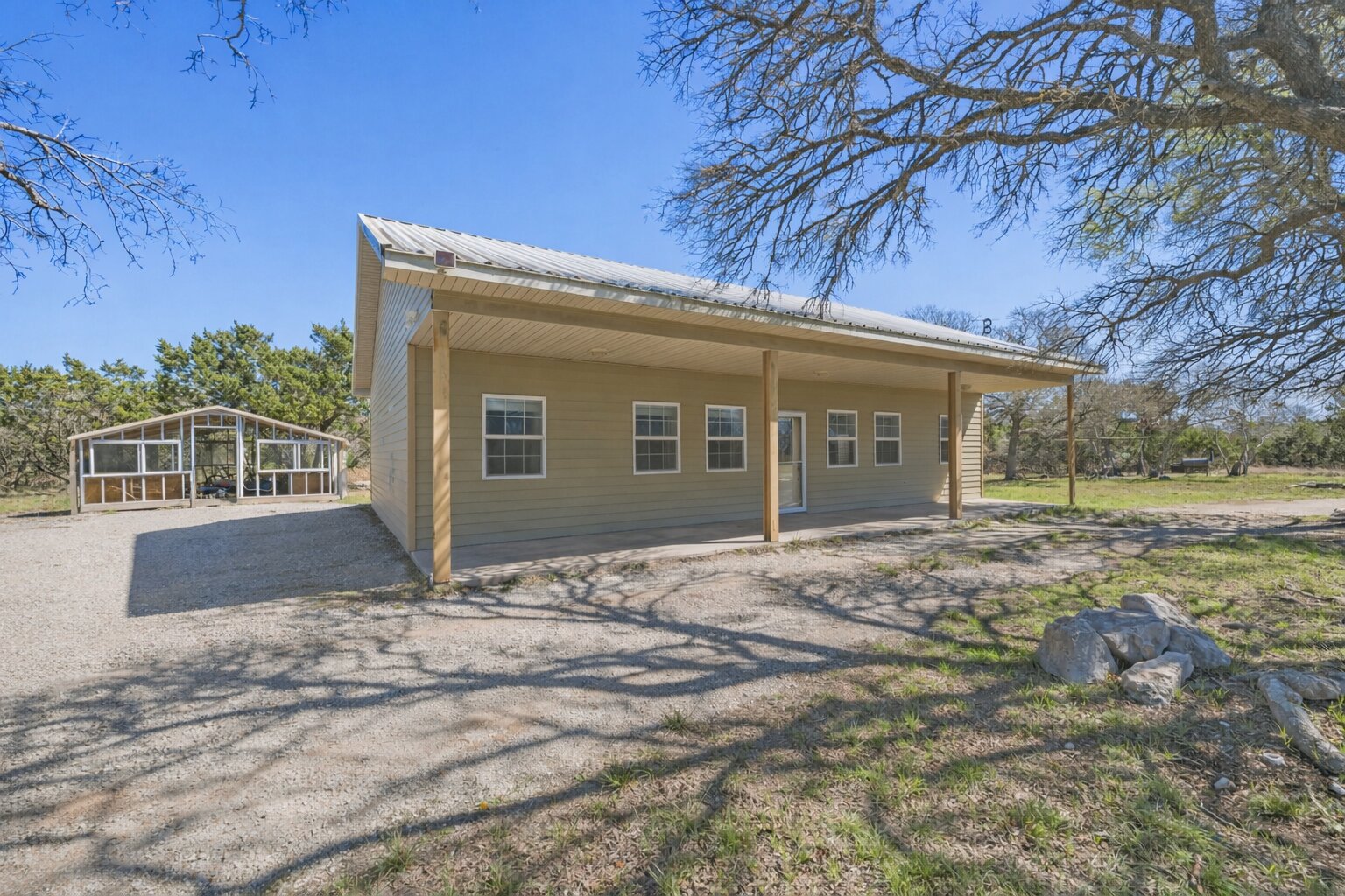 1301 Altwein Road Blanco, TX 78606 - Photo 7 of 40 Back of property featuring a metal roof