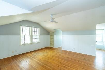 2513 21st Street, Unit FRONT Lubbock, TX 79410 - Photo 17 of 19 an empty room with wooden floor and windows