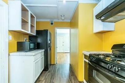 a kitchen with a stove and a refrigerator