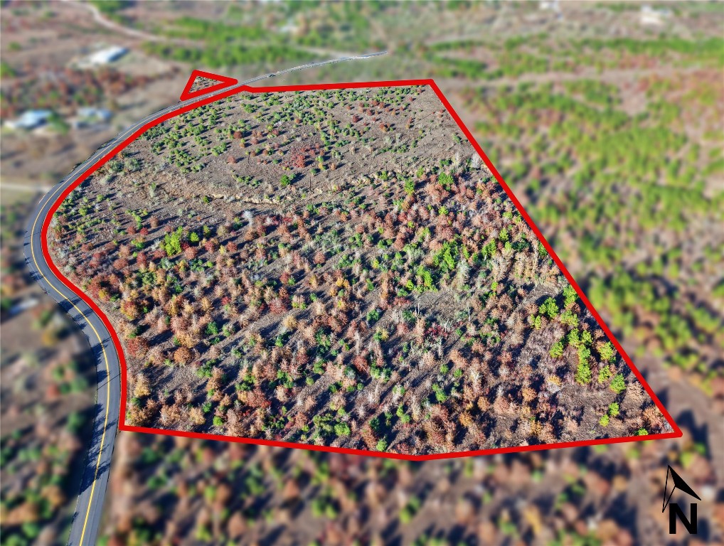 Aerial overview of property's location featuring property boundaries highlighted