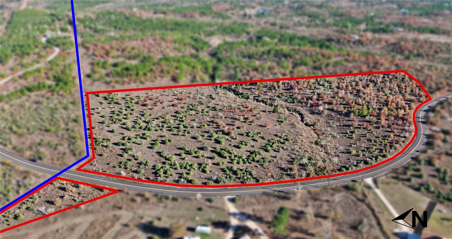 497 Cottle Town Road Smithville, TX 78957 - Photo 2 of 26 Aerial view of sparsely populated area featuring property boundaries highlighted and a desert landscape