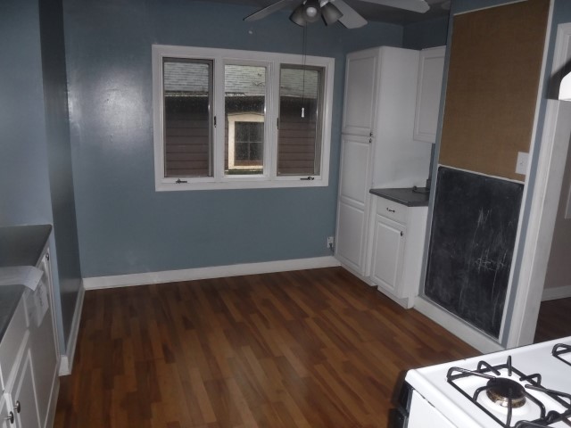 2148 Downey Road Homewood, IL 60430 - Photo 5 of 15 a view of an empty room with wooden floor and a window