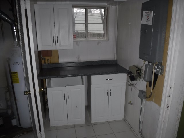 2148 Downey Road Homewood, IL 60430 - Photo 7 of 15 a bathroom with a granite countertop sink and washing machine