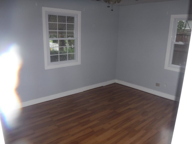 2148 Downey Road Homewood, IL 60430 - Photo 10 of 15 an empty room with wooden floor and windows