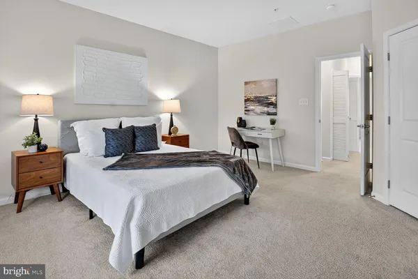 a bedroom with bed and window