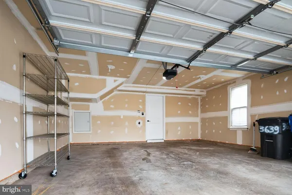 a view of an empty room with a fireplace