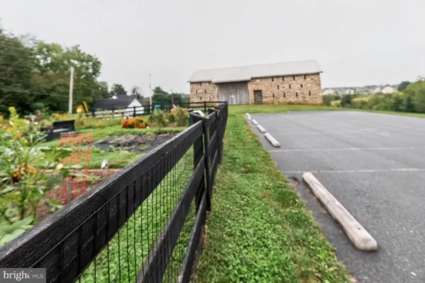 a view of a house with a yard and garden