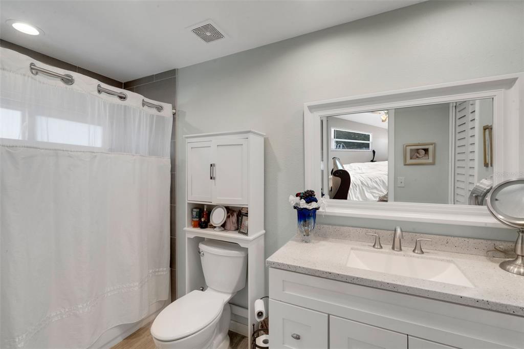 1632 Heather Place Palm Harbor, FL 34684 - Photo 14 of 39 a white toilet sitting next to a bathroom sink