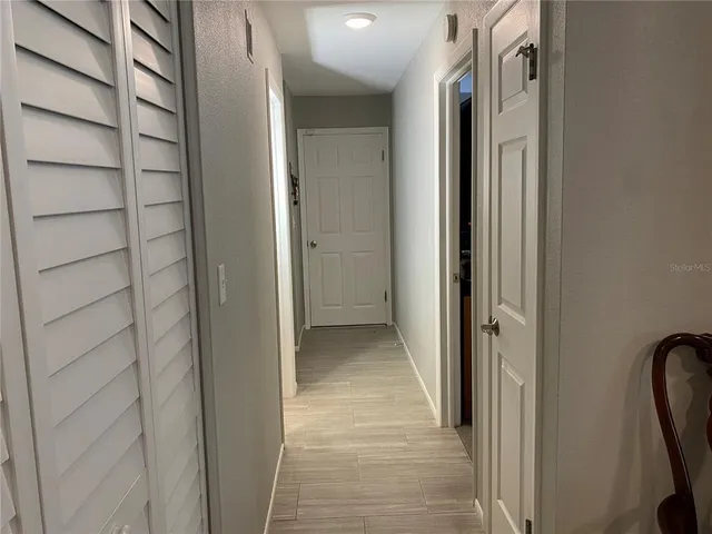 a view of a bathroom from a hallway