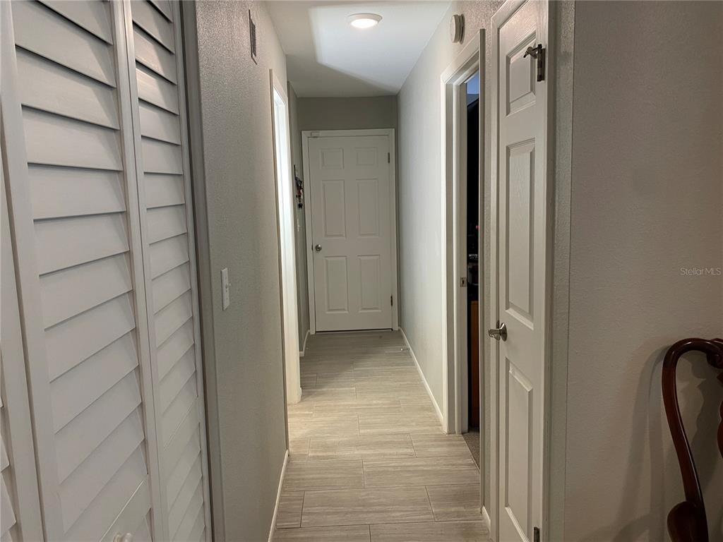 1632 Heather Place Palm Harbor, FL 34684 - Photo 18 of 39 a view of a bathroom from a hallway