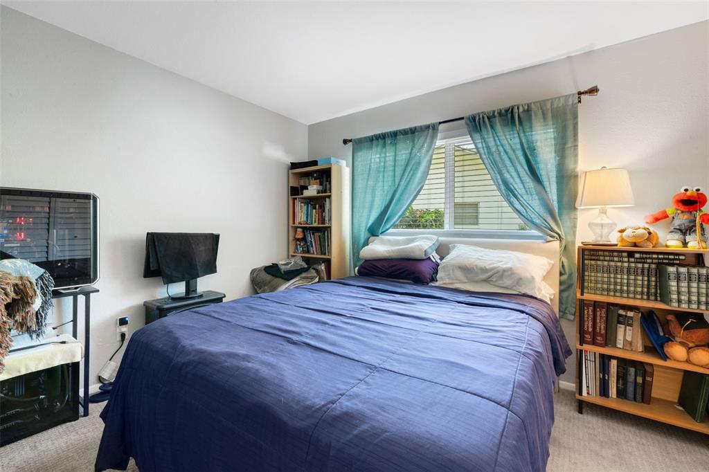 1632 Heather Place Palm Harbor, FL 34684 - Photo 20 of 39 a bedroom with a bed and a window