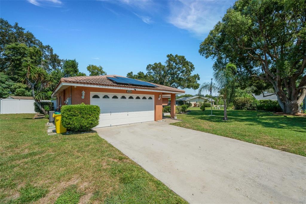 1632 Heather Place Palm Harbor, FL 34684 - Photo 35 of 39 front view of a house with a yard