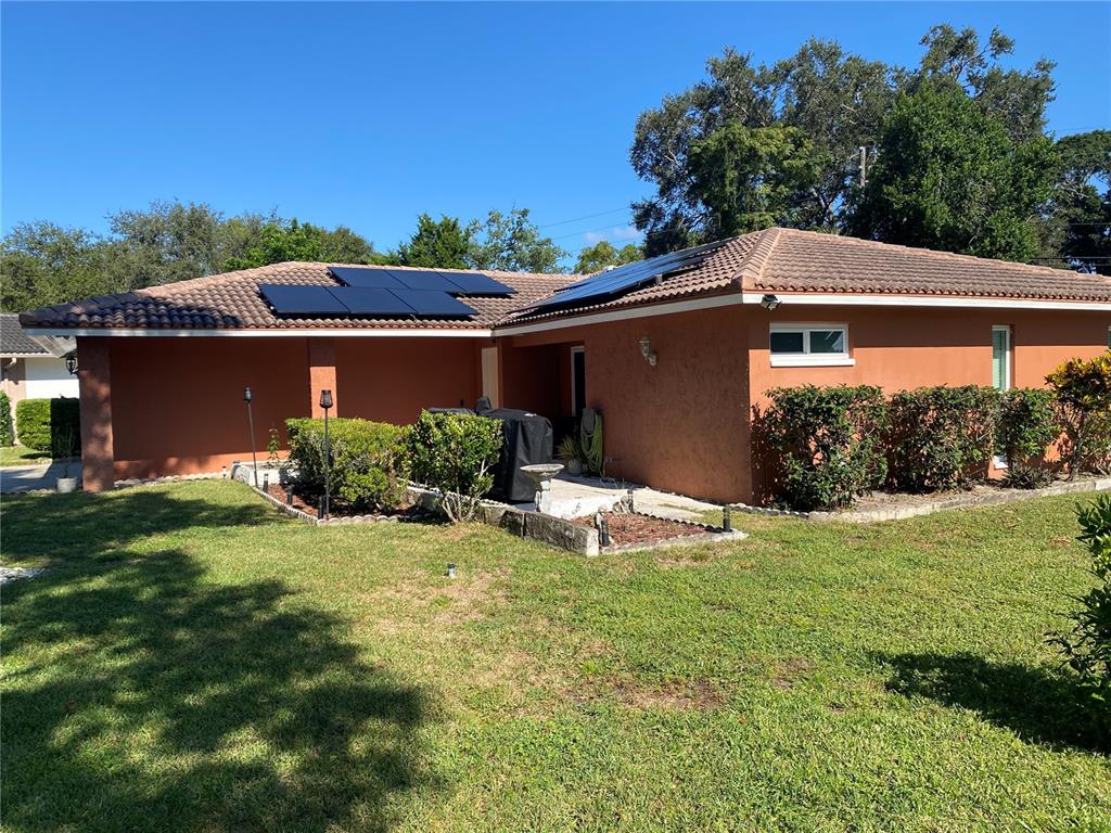 1632 Heather Place Palm Harbor, FL 34684 - Photo 39 of 39 a view of a house with a yard