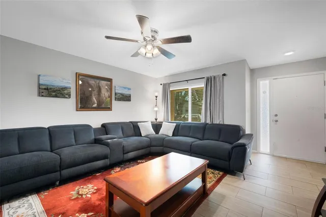 a living room with furniture and a window