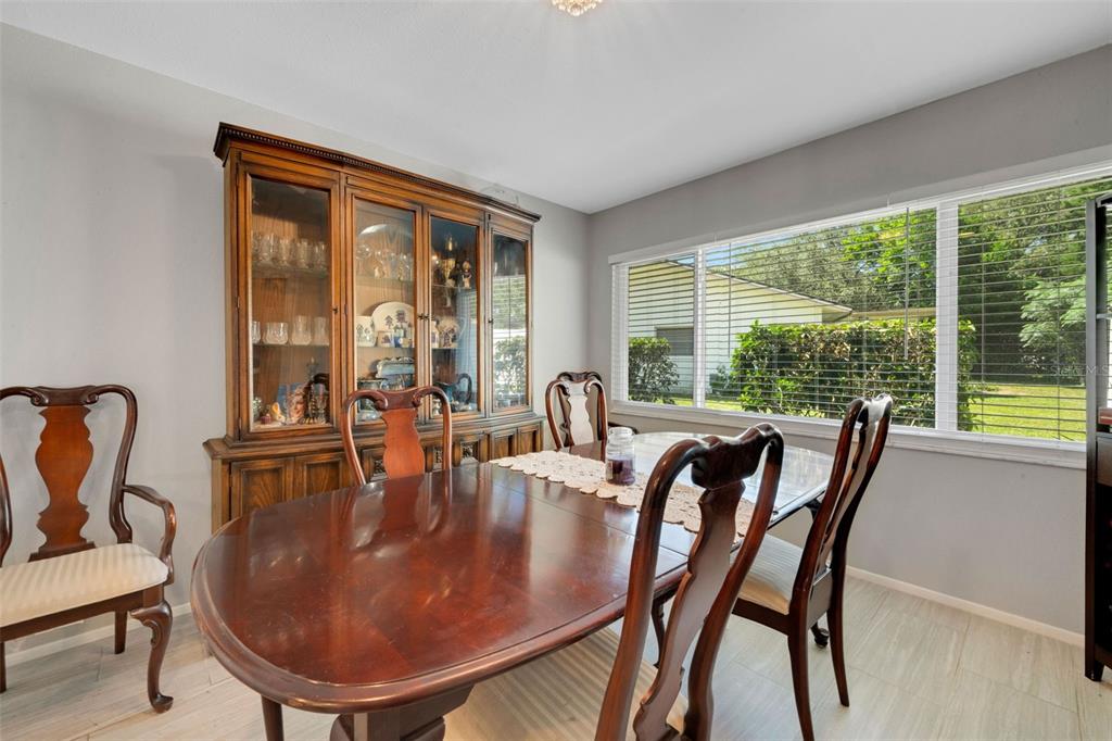 1632 Heather Place Palm Harbor, FL 34684 - Photo 10 of 39 a dining room with furniture window and outside view