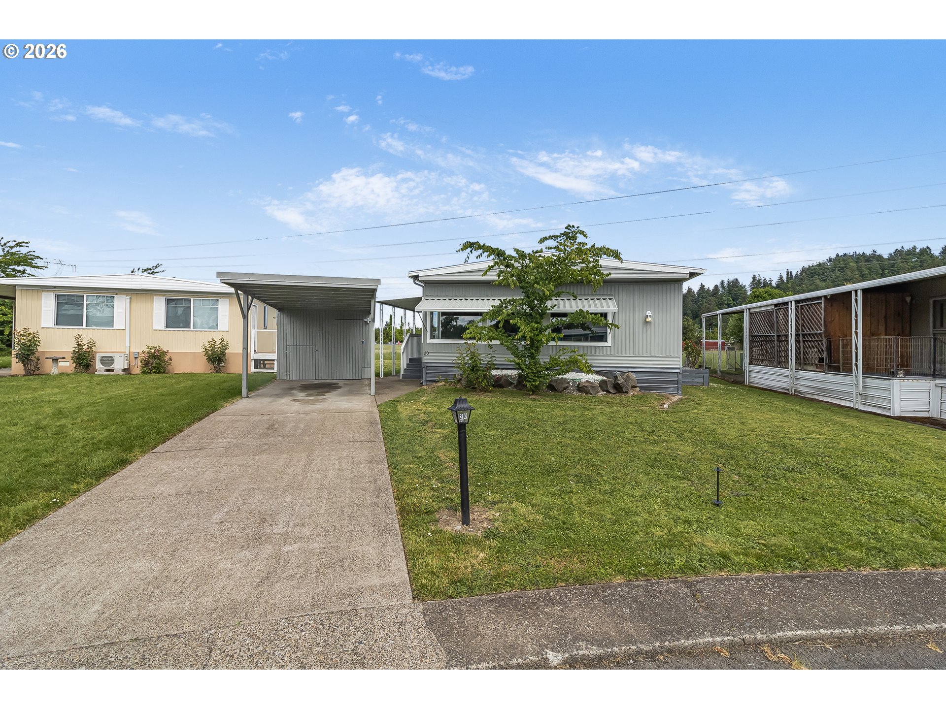 205 South 54th Street, Unit 20 Springfield, OR 97478 - Photo 30 of 32 a front view of a house with a yard