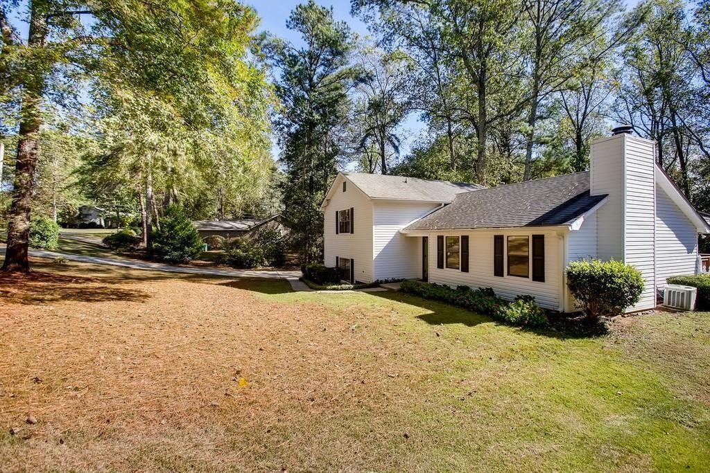 2274 Turtle Landing Marietta, GA 30066 - Photo 2 of 28 a front view of house with yard and trees in the background