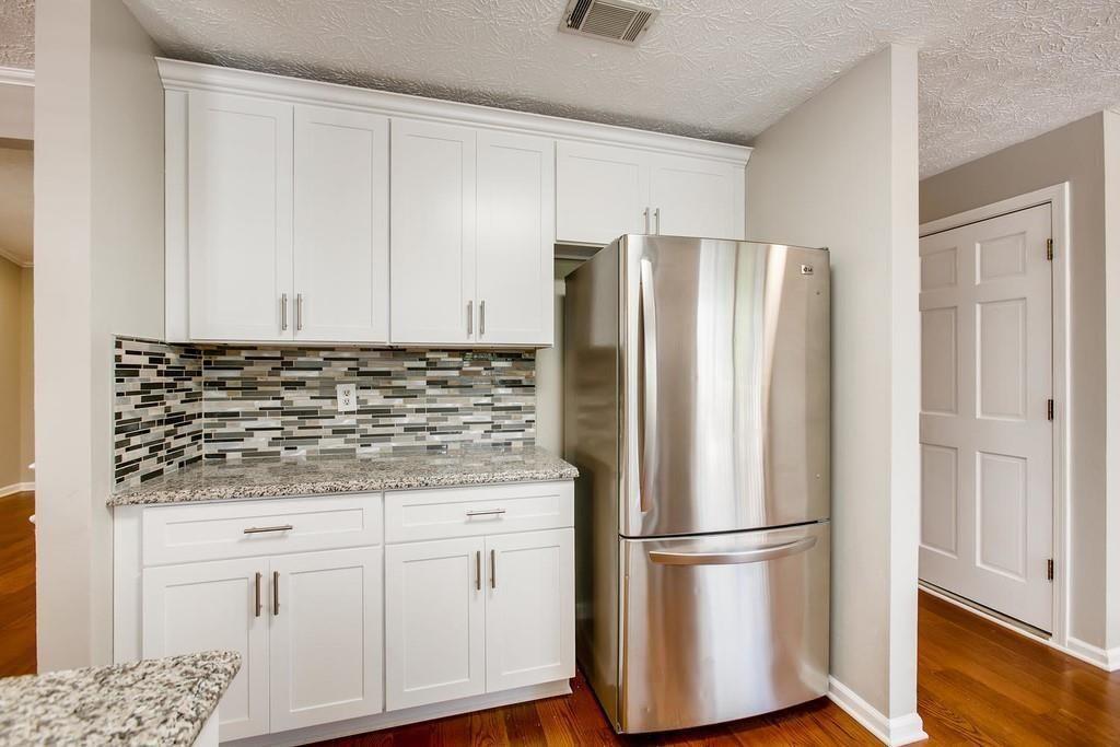 2274 Turtle Landing Marietta, GA 30066 - Photo 22 of 28 a white refrigerator freezer sitting inside of a kitchen