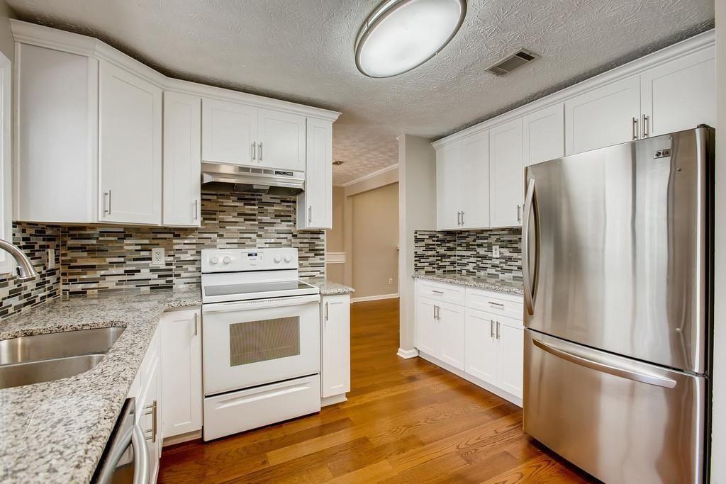 2274 Turtle Landing Marietta, GA 30066 - Photo 23 of 28 a kitchen with a refrigerator stove and sink