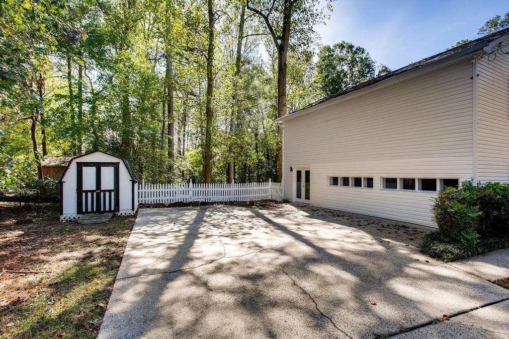2274 Turtle Landing Marietta, GA 30066 - Photo 5 of 28 a view of a house with a yard and large tree