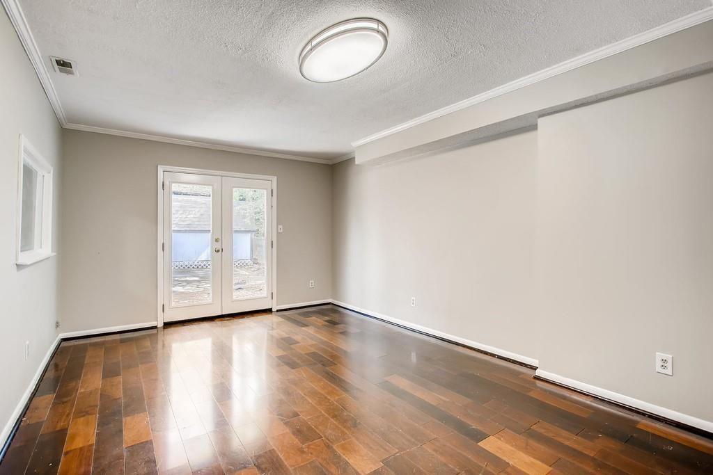 2274 Turtle Landing Marietta, GA 30066 - Photo 10 of 28 an empty room with wooden floor and windows