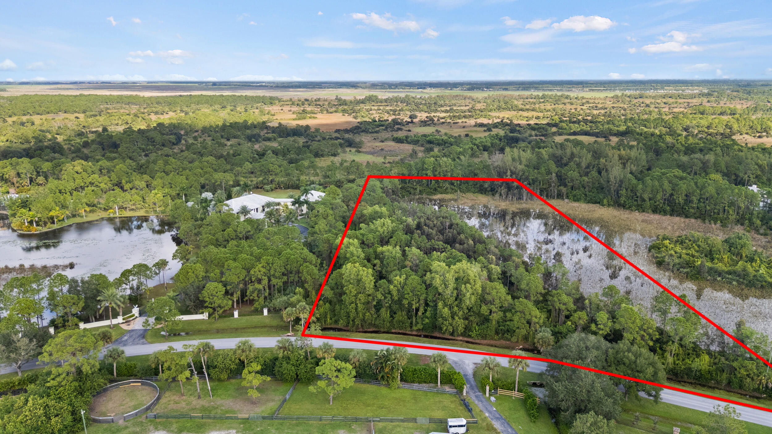 2524 Southeast Ranch Acres Circle Jupiter, FL 33478 - Photo 2 of 5 DJI_20251104231548_0392_D